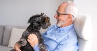 man holding his dog